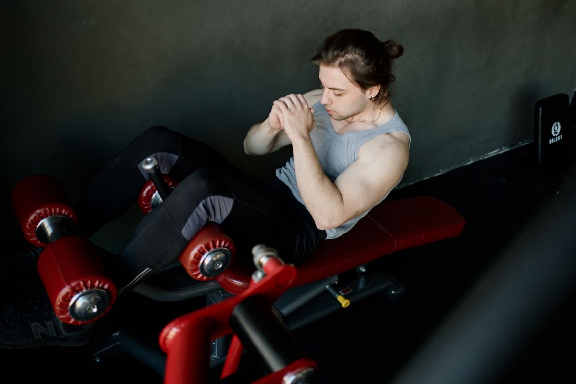 An active man strength training in a gym
